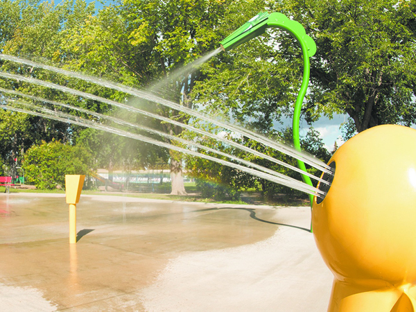 Spray pad spraying water